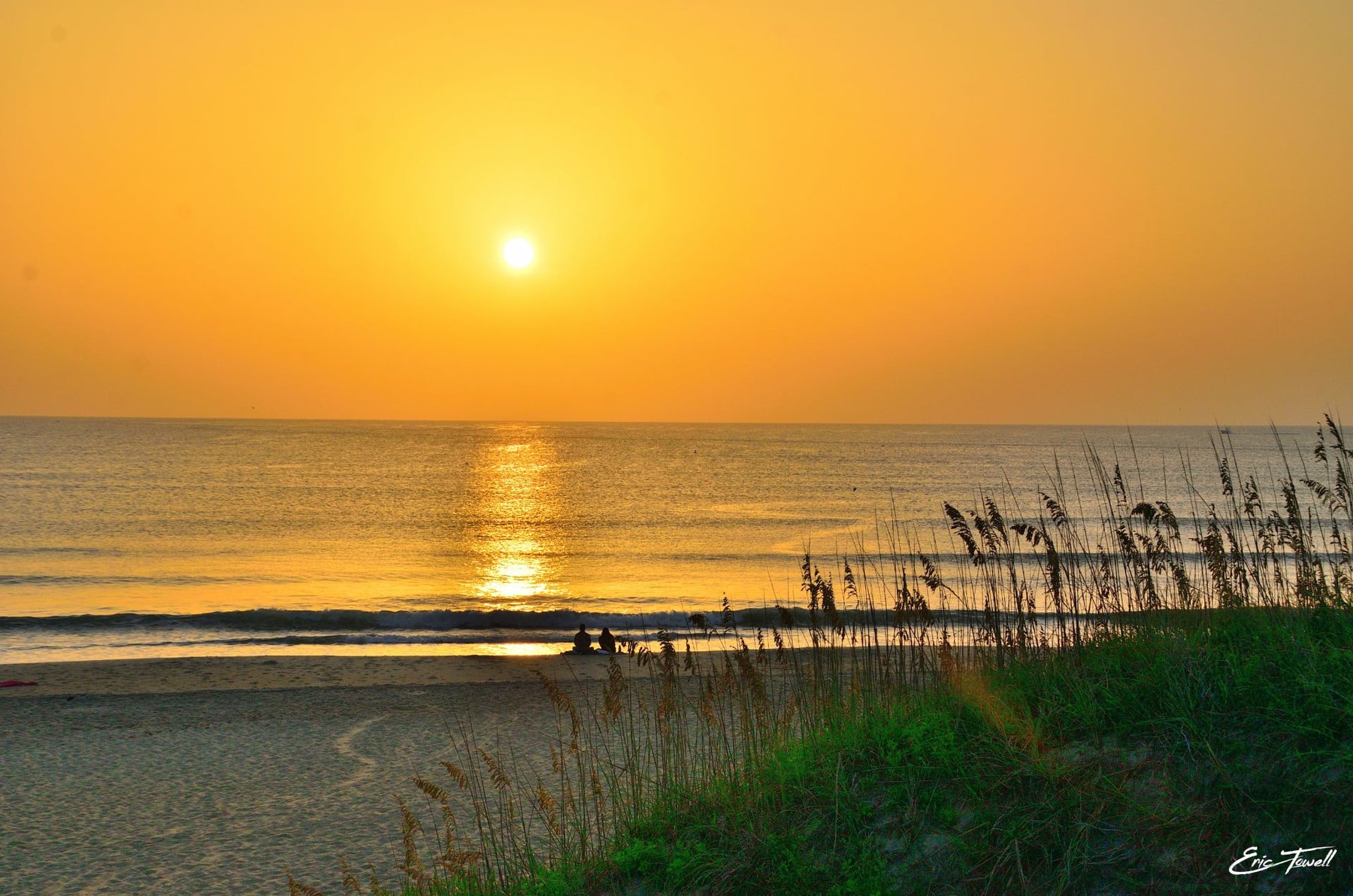 Sunrise over the ocean and sea oats